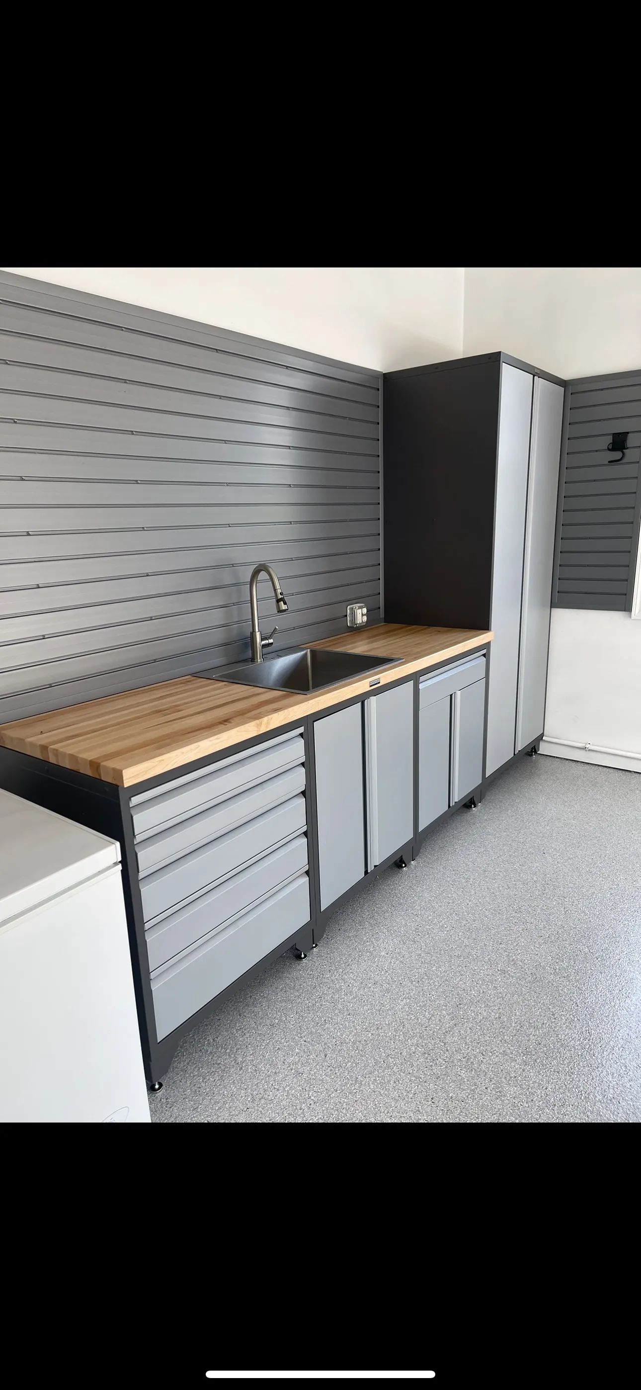 Metal garage cabinets with worktop and sink