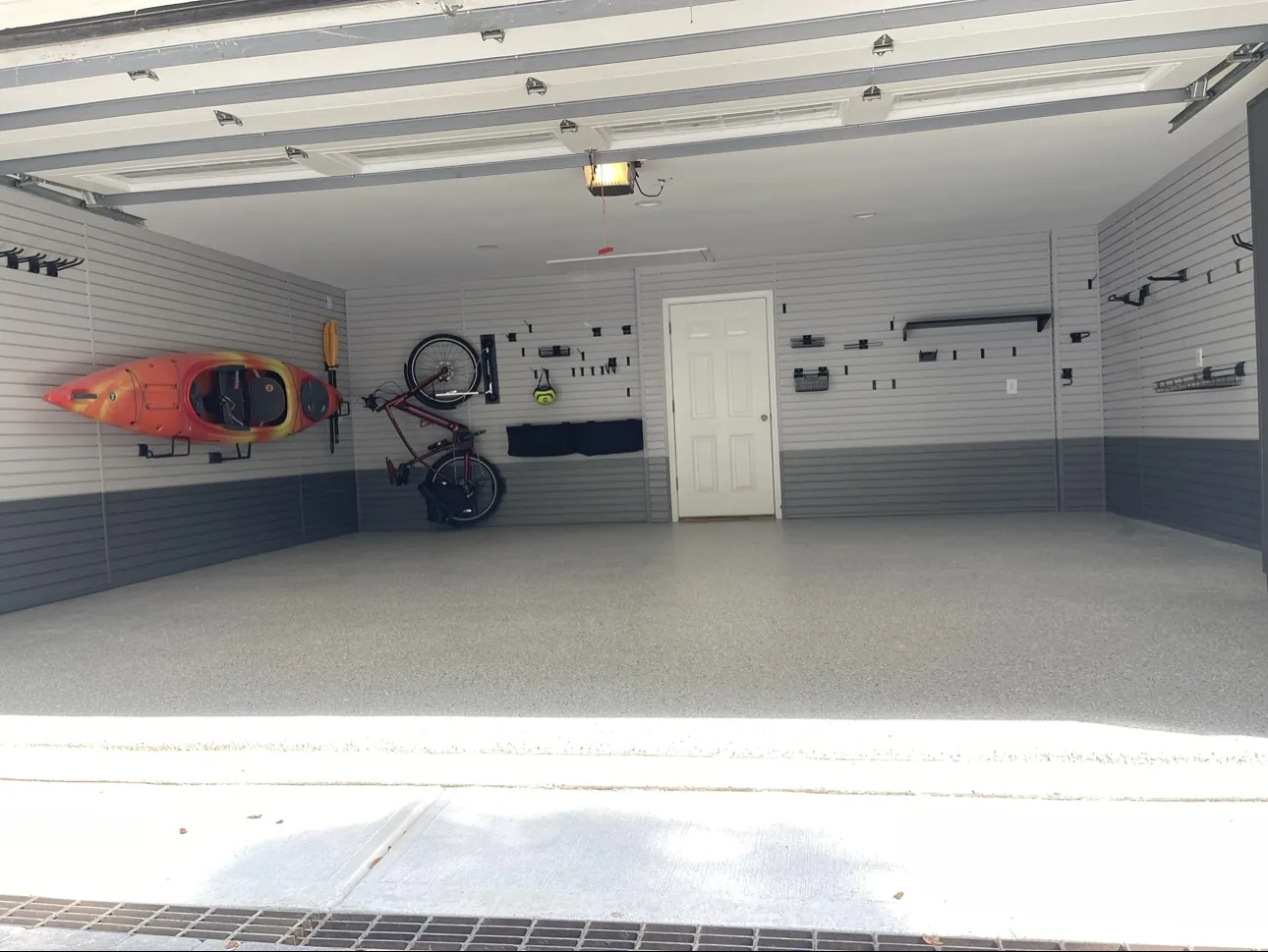Finished garage with slatwall walls and epoxy flake floor
