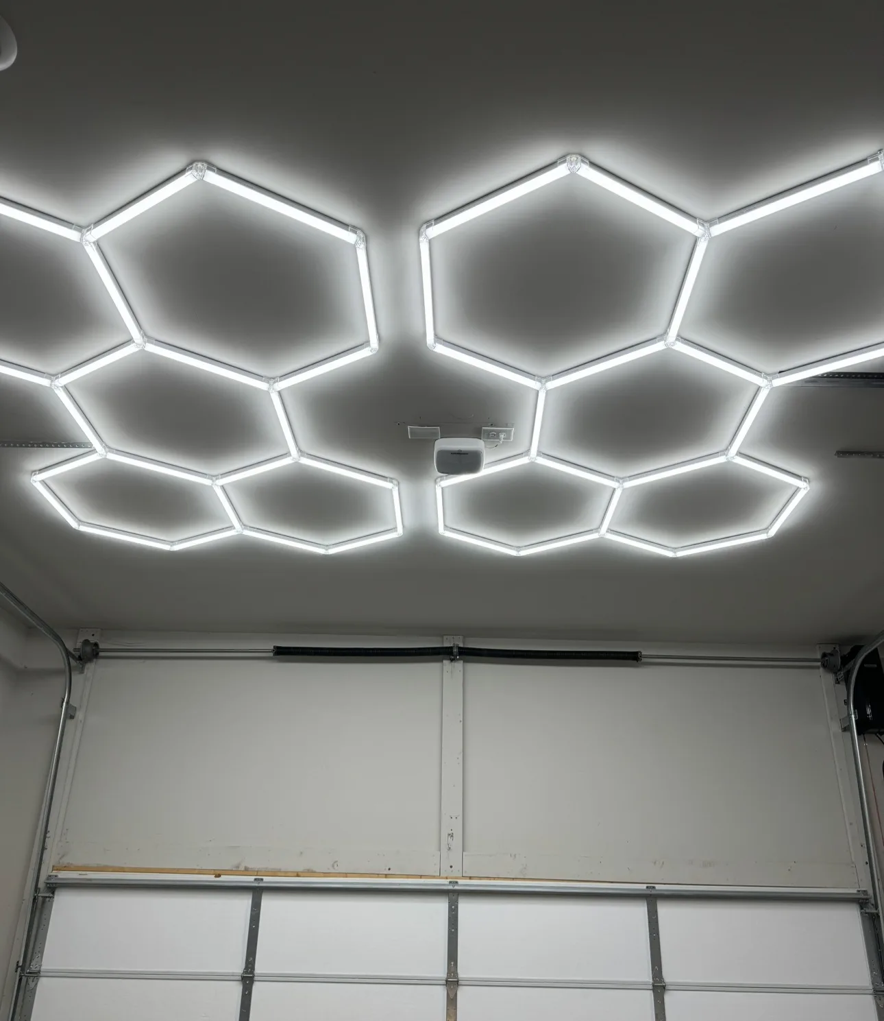 Real honeycomb LED lights installed on a garage ceiling